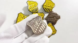 Custom gold metal lapel pins in soft or hard enamel from China wholesale, ideal for hats and clothes